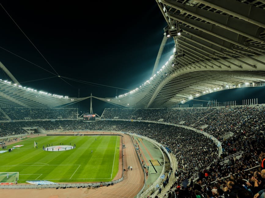 Estádio de futebol iluminado à noite