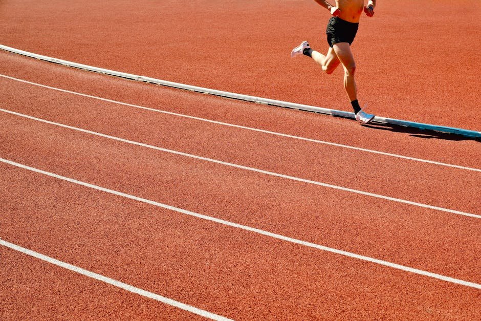 Atleta em treinamento de corrida em pista